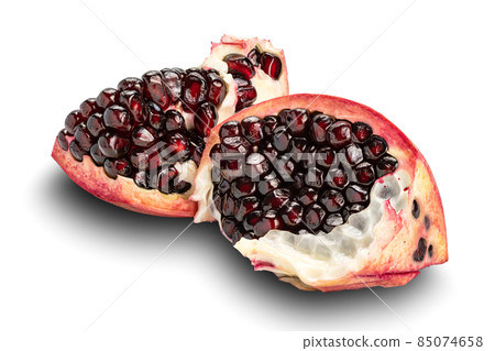 Pieces of ripe sweet pomegranate isolated on white background. Pieces of ripe sweet pomegranate isolated on white background. 85074658