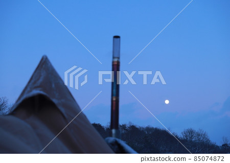 Wood stove and moon in winter camp Wood stove and moon in winter camp 85074872