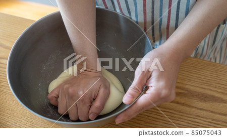 Handmade bread | Women's hands that knead the dough Handmade bread | Women's hands that knead the dough 85075043