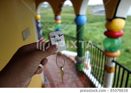 Close up shot of a wall plug with key in Penghu island Close up shot of a wall plug with key in Penghu island 85076638
