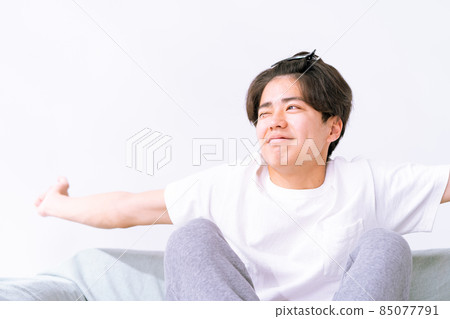 Stretching man waking up in the morning Stretching man waking up in the morning 85077791
