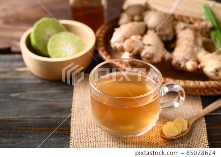 Ginger tea with lime and honey on wooden background, Healthy herbal drink Ginger tea with lime and honey on wooden background, Healthy herbal drink 85078624