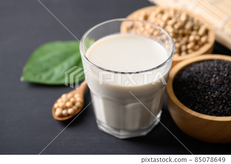 Soy milk with black sesame on black background, Healthy drink Soy milk with black sesame on black background, Healthy drink 85078649