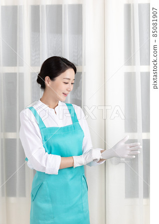 Asian woman wearing white shirt and apron, professional home cleaning service job 85081907