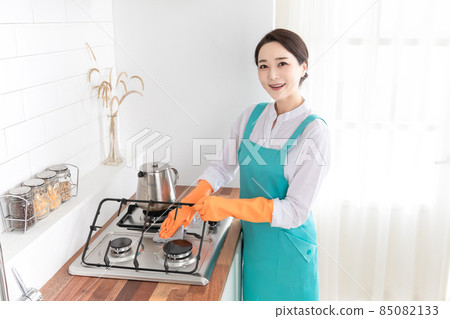 Asian woman wearing white shirt and apron, professional home cleaning service job 85082133