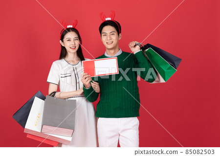 Asian Korean couple in winter fashion, Christmas shopping event concept 85082503