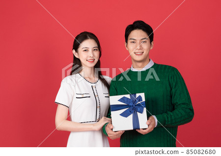 Asian Korean couple in winter fashion, Christmas shopping event concept 85082680