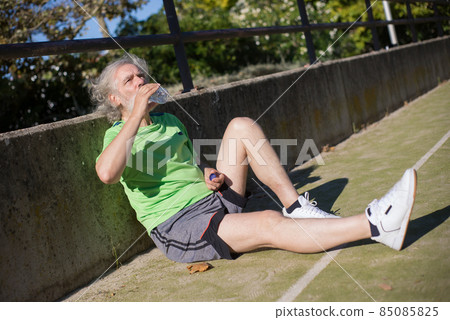Senior man resting after football training 85085825
