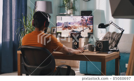 Male gamer playing tank videogame Male gamer playing tank videogame 85088697