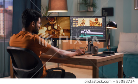 Unrecognizable guy editing astronaut video 85088734