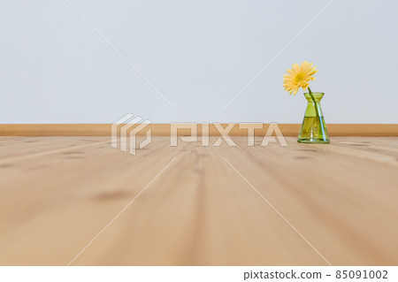 Yellow gerbera flower in a green flower vase 85091002