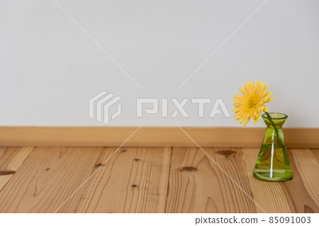 Yellow gerbera flower in a green flower vase Yellow gerbera flower in a green flower vase 85091003