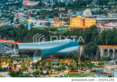 Concert Hall In Shape Of Two Metal Glass Tubes, Hi-Tech Style In Evening Rike Park, Tbilisi Georgia 85091288