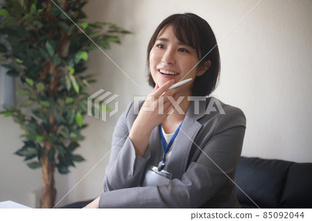 Female employee with a smile Female employee with a smile 85092044