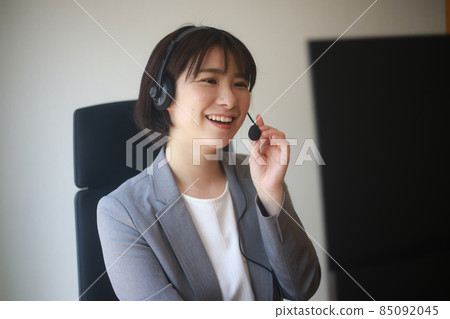 Female employee making a video call Female employee making a video call 85092045