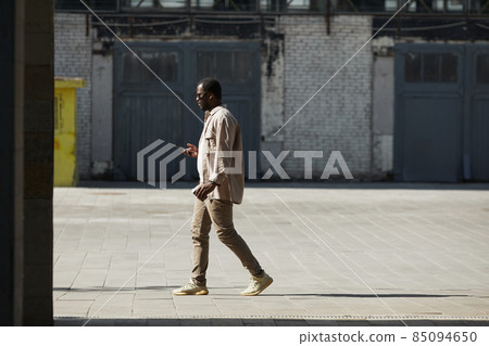 African American Man Walking in City 85094650
