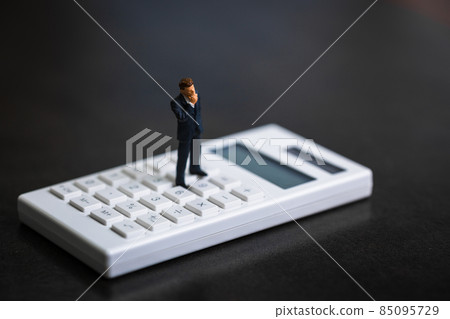 Calculator and businessman doll Calculator and businessman doll 85095729