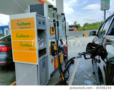 SELANGOR, MALAYSIA -MARCH 05, 2021: Shell petrol station and fuel pump dispenser. Shell provided self-service dispenser with a self-service payment method to avoid human interaction. 85096234