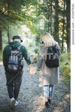 Traveler couple in love enjoying in the forest. Freedom and active lifestyle concept. 85097690