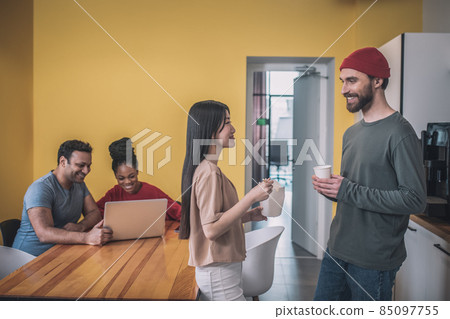 Guy with coffee and girl with asian food 85097755