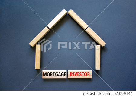 Mortgage investor symbol. Concept words 'Mortgage investor' on wooden blocks near miniature wooden house. Beautiful grey background. Business, mortgage investor concept. Mortgage investor symbol. Concept words 'Mortgage investor' on wooden blocks near miniature wooden house. Beautiful grey background. Business, mortgage investor concept. 85099144
