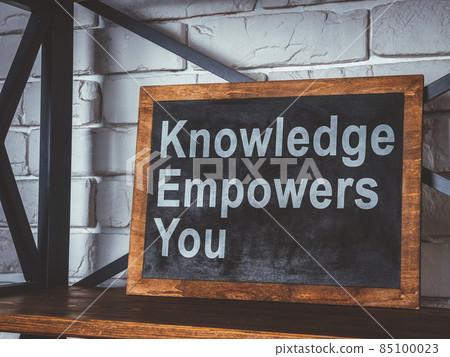 Knowledge empowers you phrase on the blackboard. 85100023