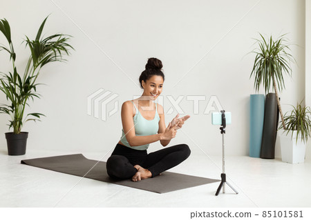 Remote Coaching. Smiling Female Yoga Instructor Recording Video Tutorials In Studio 85101581