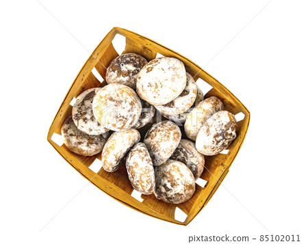 Sweet cookies in a wooden box on a white background with place for text. 85102011