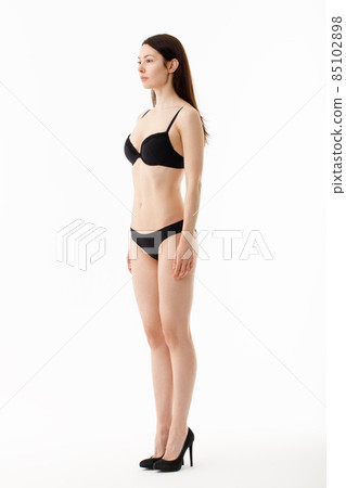 Model tests. Snap Models back view, Beautiful brunette woman in underwear, isolated on white. Model tests. Snap Models back view, Beautiful brunette woman in underwear, isolated on white. 85102898