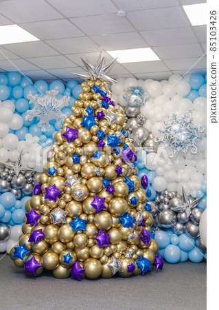 The figure of a Christmas tree made of balloons. The symbol of the new 2022 The figure of a Christmas tree made of balloons. The symbol of the new 2022 85103426