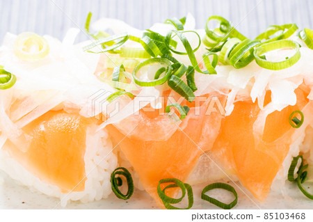 Salmon salad nigiri sushi. 85103468