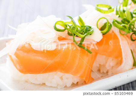 Salmon salad nigiri sushi. 85103469