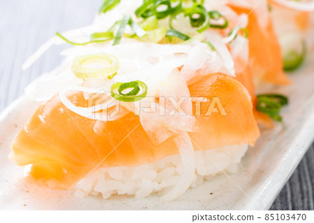 Salmon salad nigiri sushi. 85103470