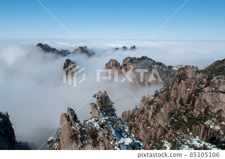 Sunrise scenery on a winter day with a sea of clouds in Huangshan, China Sunrise scenery on a winter day with a sea of clouds in Huangshan, China 85105106