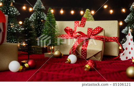 Gift box and christmas balls decoration with bokeh lights for christmas and new year theme Gift box and christmas balls decoration with bokeh lights for christmas and new year theme 85106121