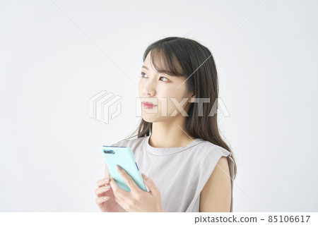 Female smartphone thinking white background Female smartphone thinking white background 85106617