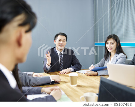 asian corporate business people talking during discussion meeting in office asian corporate business people talking during discussion meeting in office 85107498