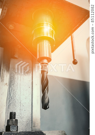 Close-up machine for drilling holes in metal. Equipment with drill for vertical drilling. Factory 85112082