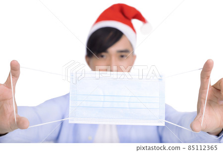 Young man Christmas face mask virus covid-19 Young man Christmas face mask virus covid-19 85112365