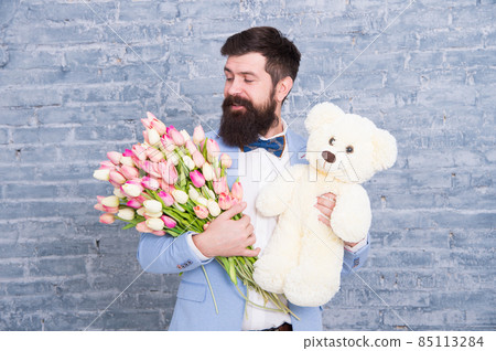 Thank you. Spring gift. Bearded man hipster with spring Thank you. Spring gift. Bearded man hipster with spring 85113284