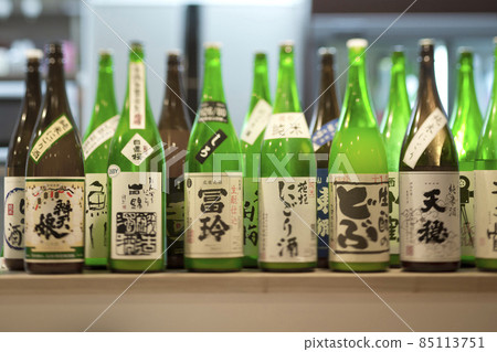 One box bottle lined up on the counter 85113751