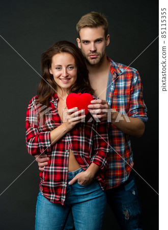 sexy young couple in love hold heart on black background, relations 85115355