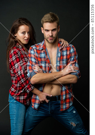sexy man and woman embrace together in checkered shirt, relationship 85115356