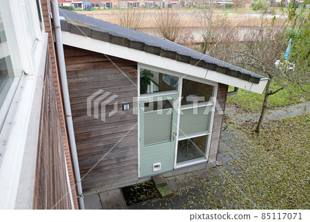 Fall in a garden, leaves waiting to be raked 85117071