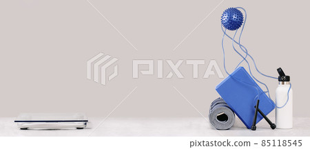 Rolled yoga mat and exercise skipping rope Rolled yoga mat and exercise skipping rope 85118545