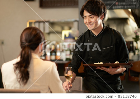 Asian man servicing at a restaurant 85118746