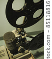 Old style movie projector, still-life, close-up. vintage, old-fashioned film projector, blurred background 85118816