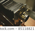 Old antique camera, close-up, blurred background, lens 85118821