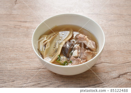 boiled slice Chinese bamboo shoot with pork bone and mushroom soup on bowl 85122488