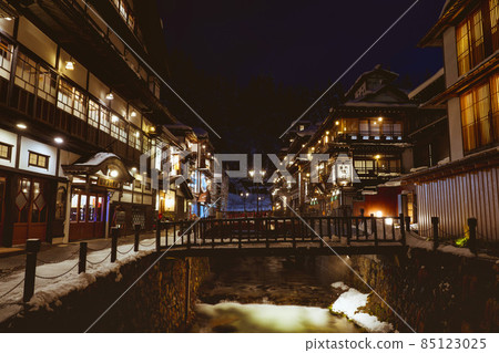Scenery of Ginzan Onsen Obanazawa City, Yamagata Prefecture, on a winter night with snow Scenery of Ginzan Onsen Obanazawa City, Yamagata Prefecture, on a winter night with snow 85123025